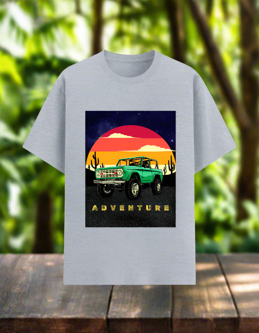 Men’s Adventure T‑shirt with retro desert sunset and green off‑road 4x4 graphic, front view, poly‑cotton 180 GSM. Grey