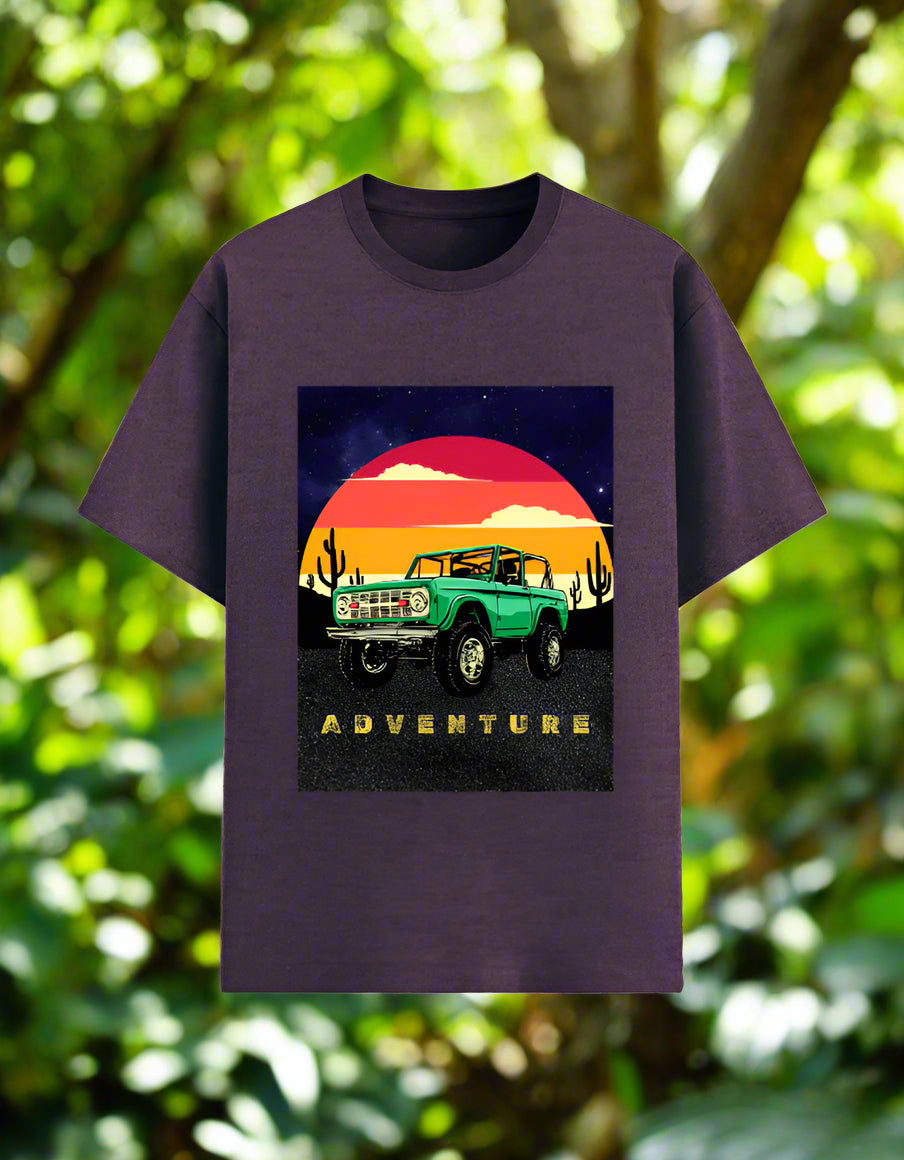 Men’s Adventure T‑shirt with retro desert sunset and green off‑road 4x4 graphic, front view, poly‑cotton 180 GSM. Purple